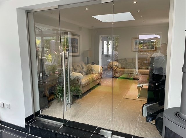 Glass partition doors in living room